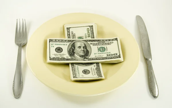 Dinheiro de dólar no prato — Fotografia de Stock