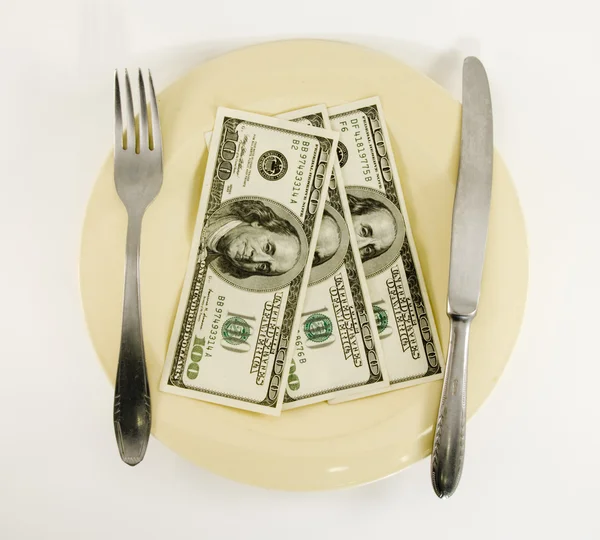 Dinheiro de dólar no prato — Fotografia de Stock
