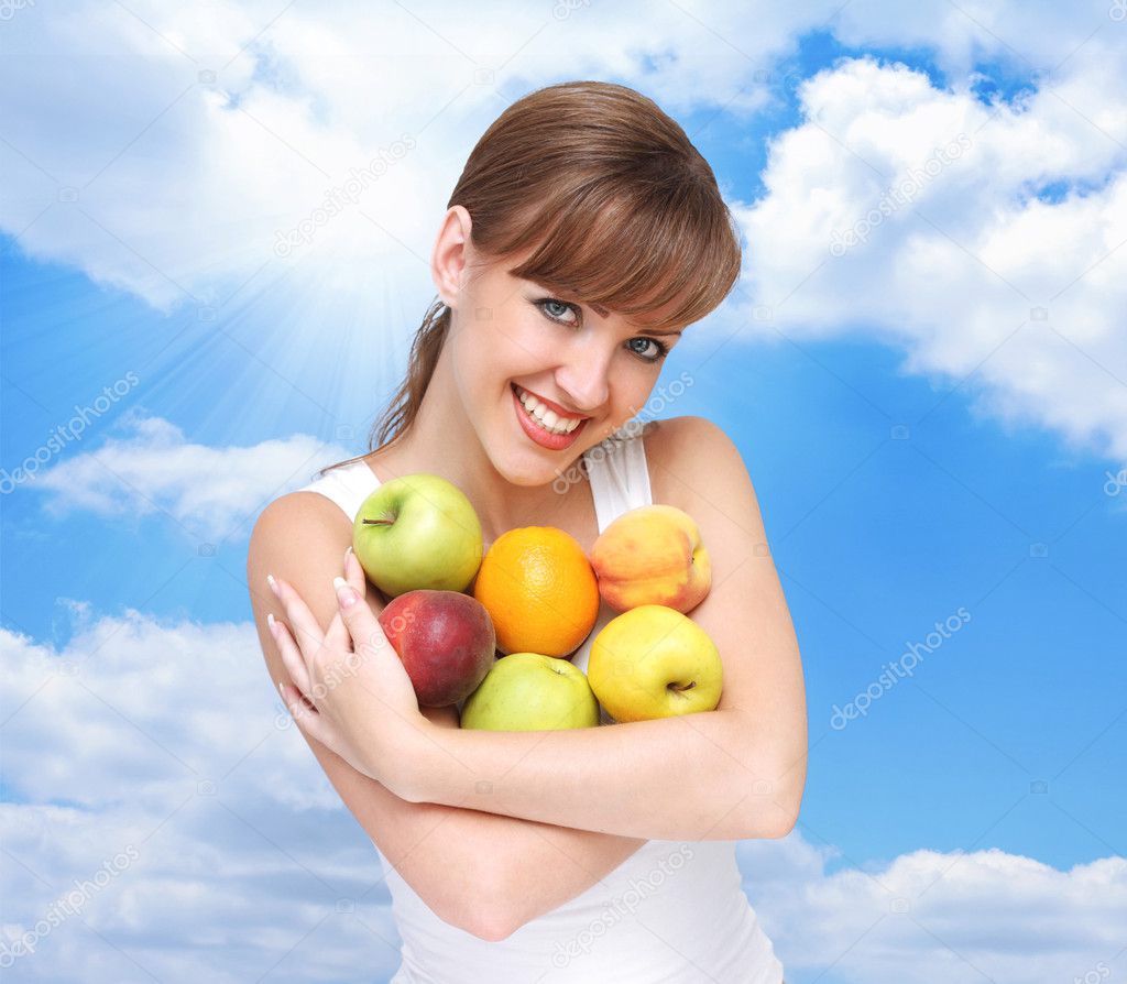 Beautiful woman with fruits