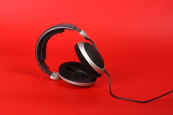 stock image Headphones on red