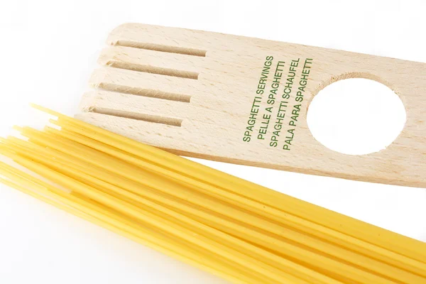 Spaghgetti and spaghetti servings — Stock Photo, Image