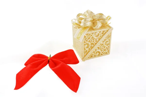 Gift box and red flake over white backgr — Stock Photo, Image