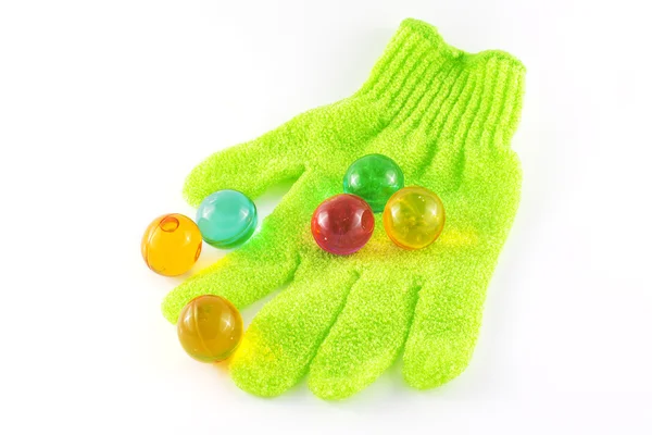 Bath glove and bath pearls — Stock Photo, Image