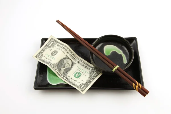 One dollar bill on a sushi plate — Stock Photo, Image