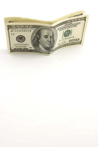 Několik stovek dolarové bankovky ve vzpřímené poloze — Stock fotografie