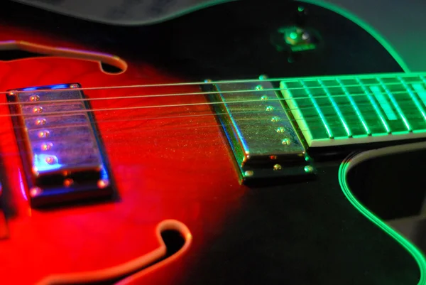 Red light guitar — Stock Photo, Image