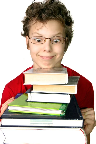 Смішний хлопчик з набором книг — стокове фото