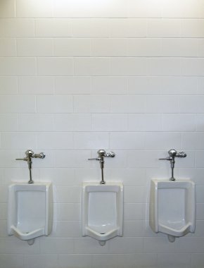 Three urinals with white background clipart