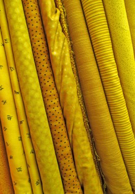 Assorted yellow fabrics background clipart