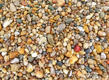 Colorful beach stones background clipart