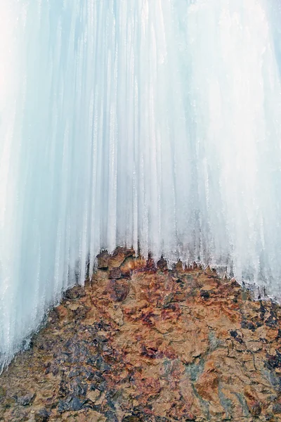 Ice sheet on cliff face background — Stock Photo, Image