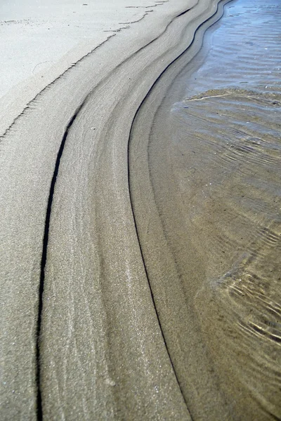Interazione di sabbia e onde — Foto Stock