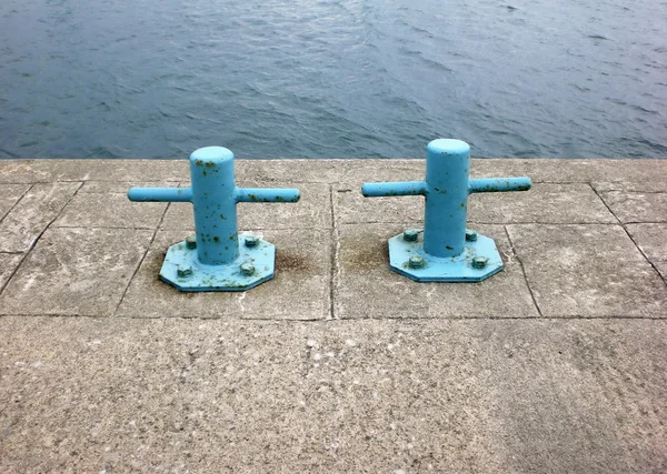 Two blue harbor bollards — Stock Photo, Image