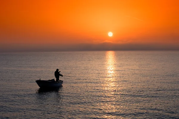 Fishing at sunset — Stock Photo, Image