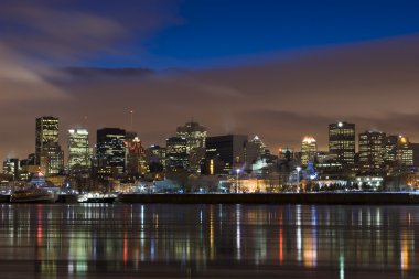 Cityscape night scene Montreal river clipart