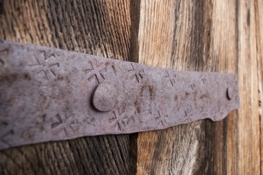 Detail of old oak wood gate with metal clipart