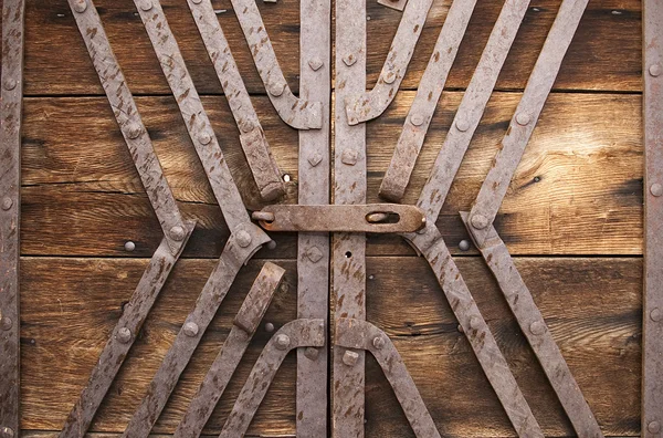 Metal lock and reinforcement wood gate — Stock Photo, Image