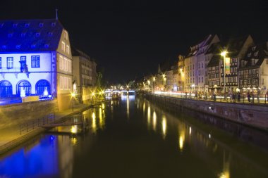 Bridge and quay in old town by night clipart