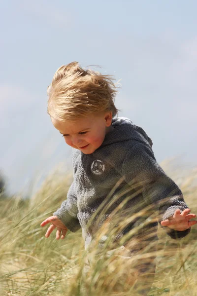 Boy in dunes — Stock Photo, Image