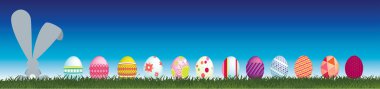 Bunny and easter eggs viewed from behind clipart