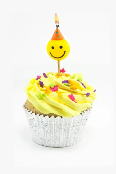 Sárga cupcake és smiley gyertya — Stock Fotó