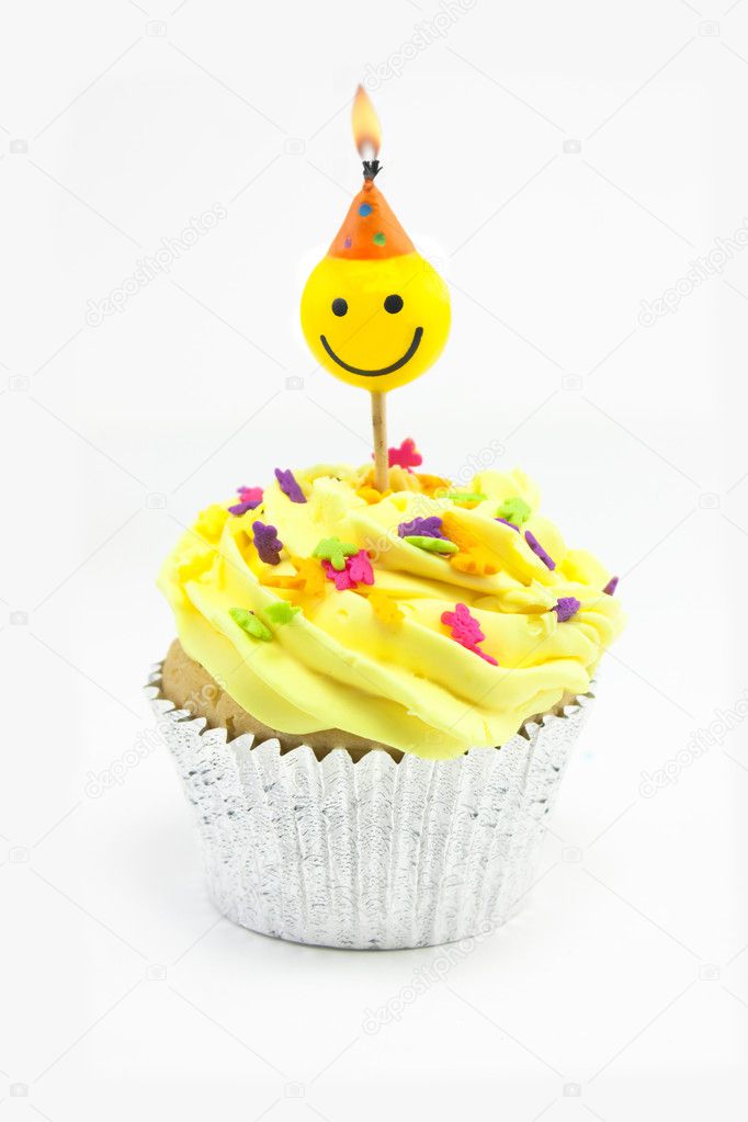 Yellow cupcake and smiley candle