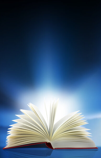 A beam of light shines out from an open book