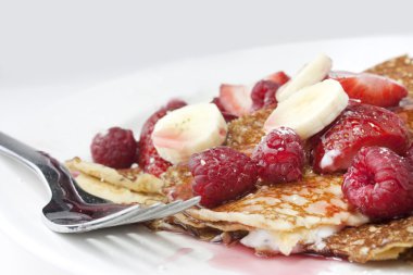 Raspberry and strawberry crepes or panca clipart