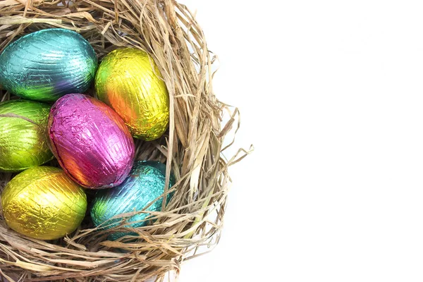 Easter eggs in nest on white — Stock Photo, Image