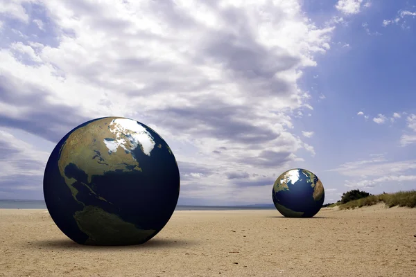 3d earth on a beach — Stock Photo, Image