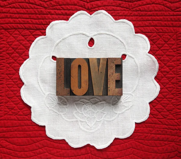 Love on linen doily — Stock Photo, Image
