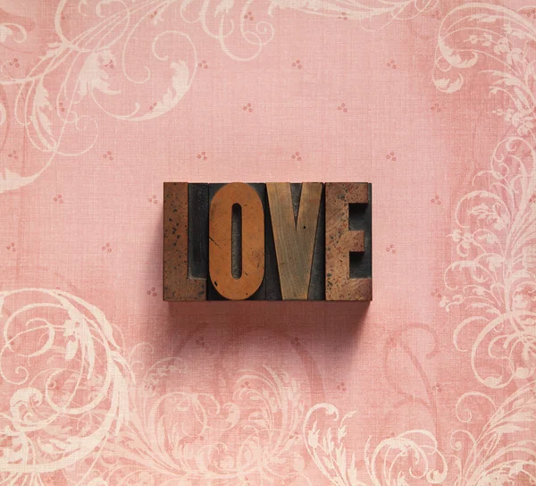 Love on a swirly background — Stock Photo, Image