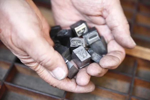 Stock image Handful of metal type