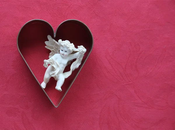 Corazón con Cupido —  Fotos de Stock