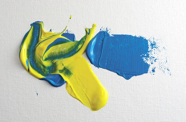 在画布上的蓝色和黄色的丙烯酸漆 — 图库照片
