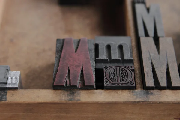 Letterpress M in wood and metal — Stock Photo, Image