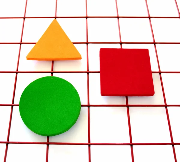 Three shapes on a grid — Stock Photo, Image