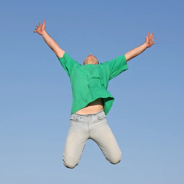 Jumping happy young man — Stock Photo © Iakov #4622080