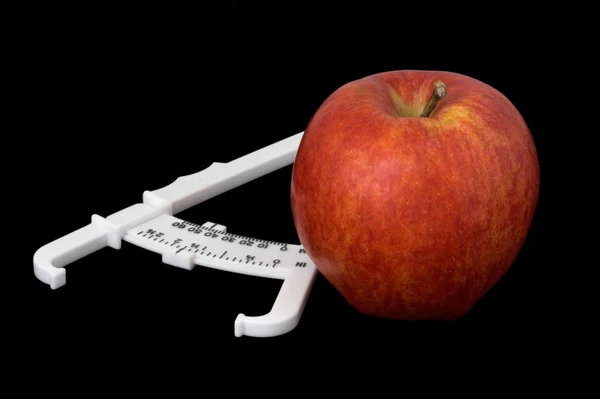 Stock image Apple and Caliper