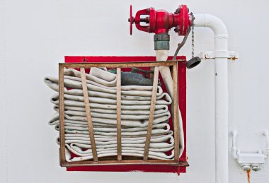 Fire Hose on Wall clipart