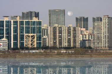 Buildings on the riverbank clipart