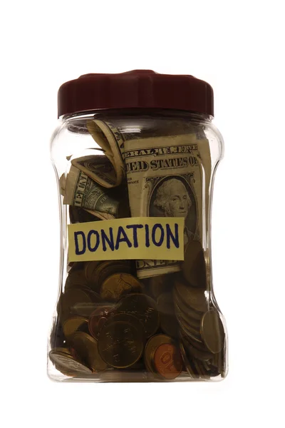 Donation i en burk — Stockfoto