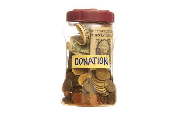 Donation i en burk — Stockfoto