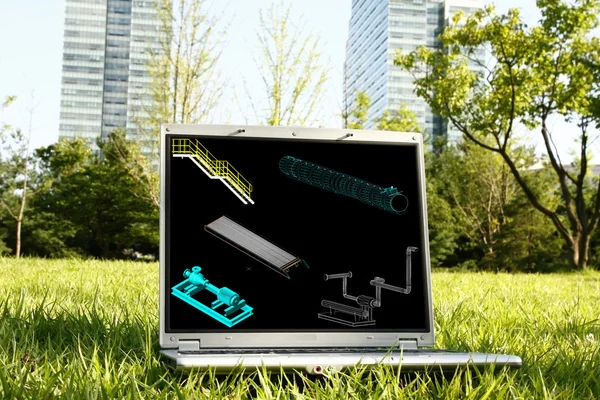 Notebook na trávě s 3d modelem — Stock fotografie