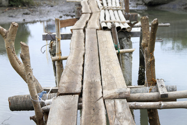 Makeshift bridge made of bamboo and wood