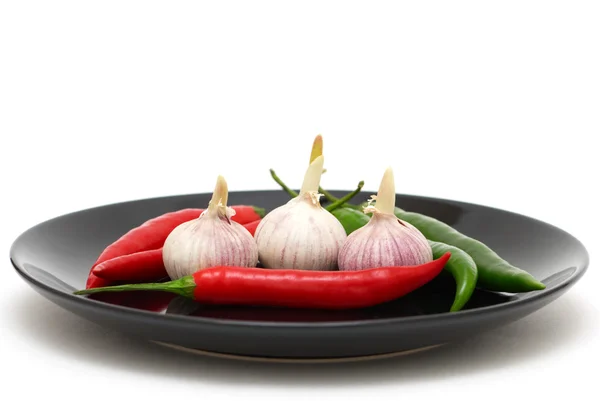Garlics and chili peppers — Stock Photo, Image
