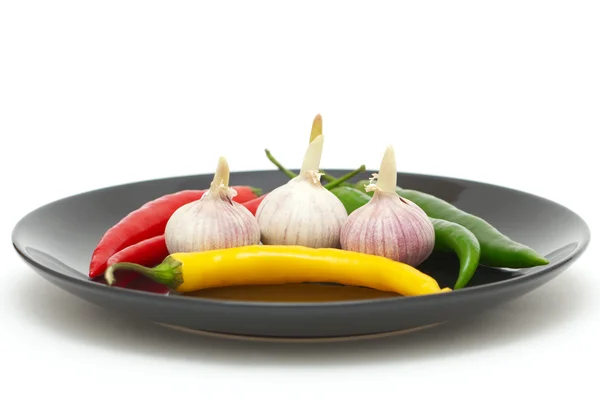 Garlics with chili peppers — Stock Photo, Image