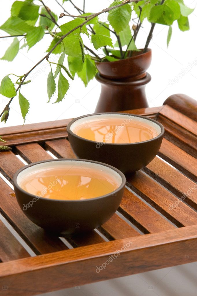 Green tea in brown cups