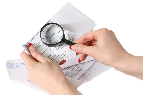 Hands, bills and magnifying glass — Stock Photo, Image