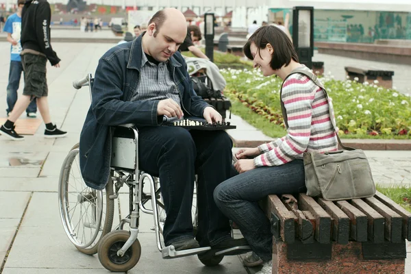 Man on a wheelchair in park — Stock Photo, Image